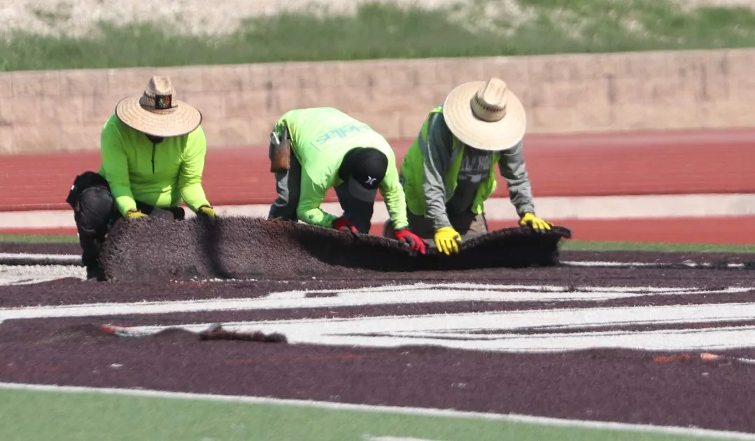 Artificial turf removal workers in action